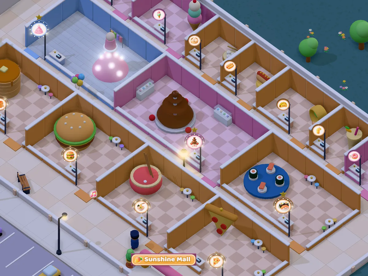 Mango Mall at night with glowing store signs and street lamps